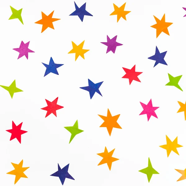 Top view of various stars carved from color paper — Stock Photo, Image