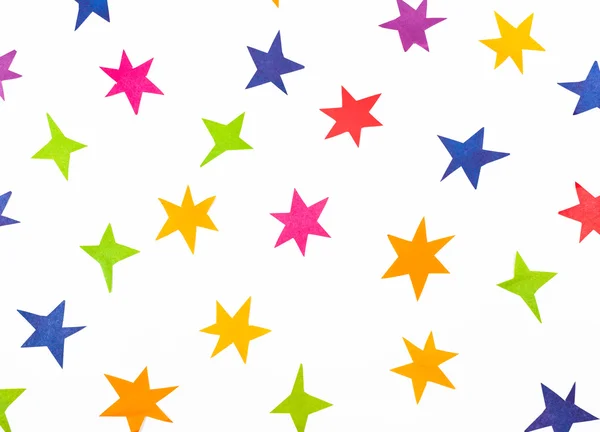 Вид зверху на зірки, вирізані вручну з кольорового паперу — стокове фото