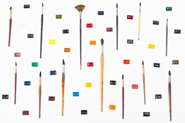 Top view of paint brushes and watercolors arranged — Stock Photo, Image
