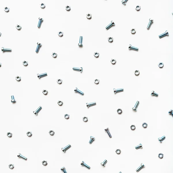 Steel bolts and nuts on white — Stock Photo, Image