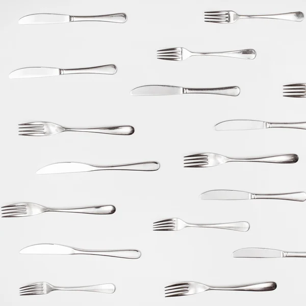 Vista superior de muchos cuchillos de mesa y tenedores —  Fotos de Stock