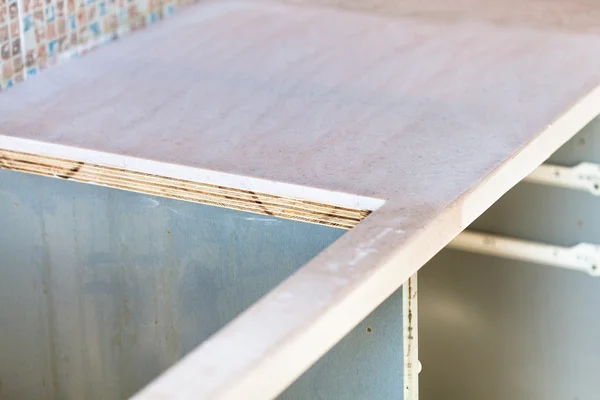 Cutout for cooking stove in new kitchen worktop — Stock Image Cutout for cooking stove in new kitchen worktop Stock Picture