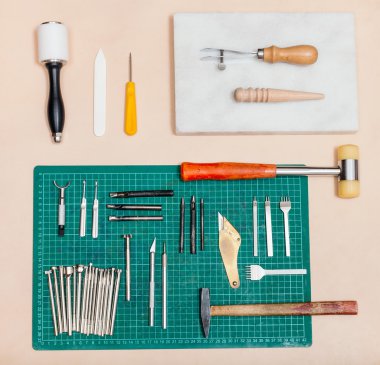above view of various tools for leatherwork clipart