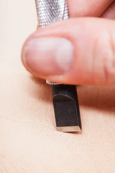 Blade of swivel knife cut leather surface close up — Stock Photo, Image