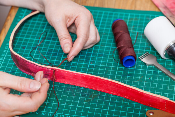 craftsman stitches new leather belt