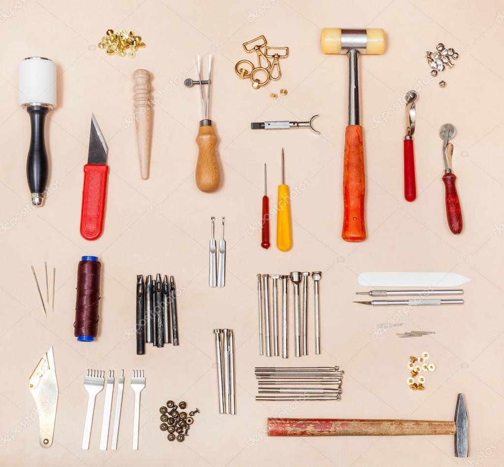 Collection various leather crafting tools Stock Photo by ©vvoennyy 121772652