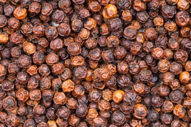 food background - red kampot pepper close up clipart