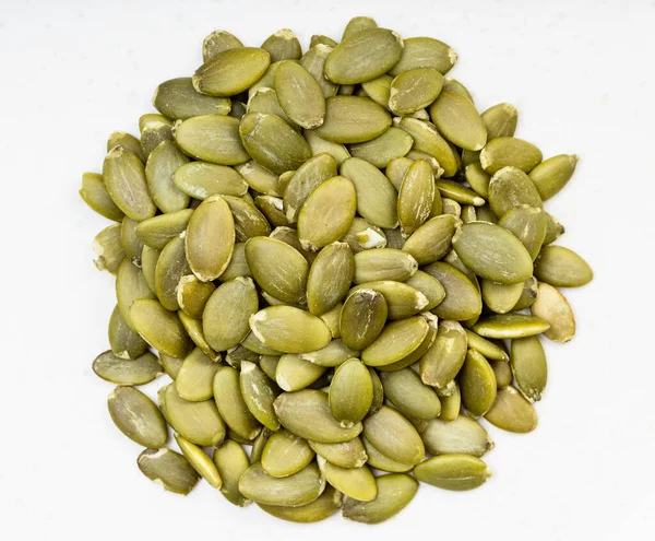 Top View Pile Hulled Pumpkin Seeds Close Gray Ceramic Plate — Stock Photo, Image