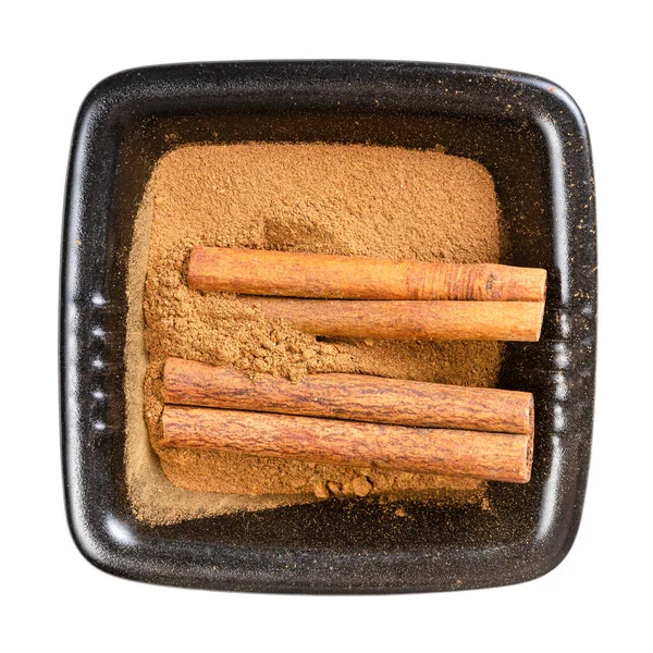 Top View Cinnamon Sticks Powder Black Bowl Isolated White Background — Stock Photo, Image