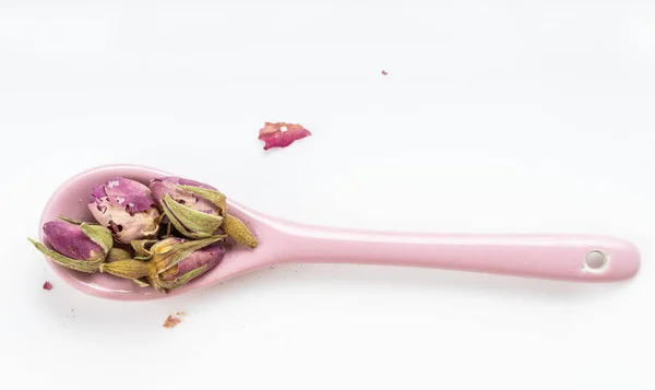 Top View Old Dried Rosebuds Ceramic Spoon White Plate — Stock Photo, Image