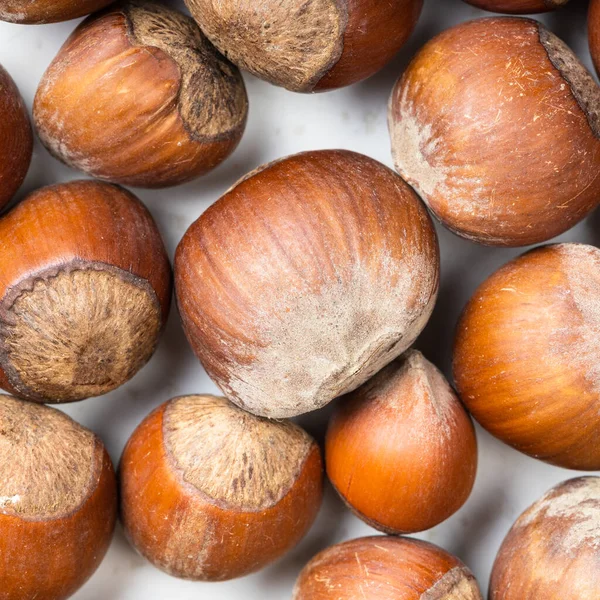 Sfondo Cibo Quadrato Nocciole Intere Primo Piano — Foto Stock