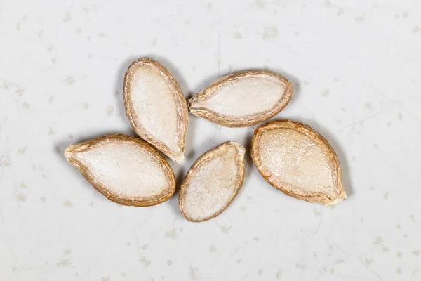 Several Whole Pumpkin Seeds Close Gray Ceramic Plate — Stock Photo, Image