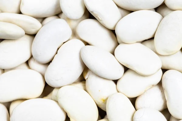 Voedsel Achtergrond Veel Ongekookte Witte Bonen Close — Stockfoto