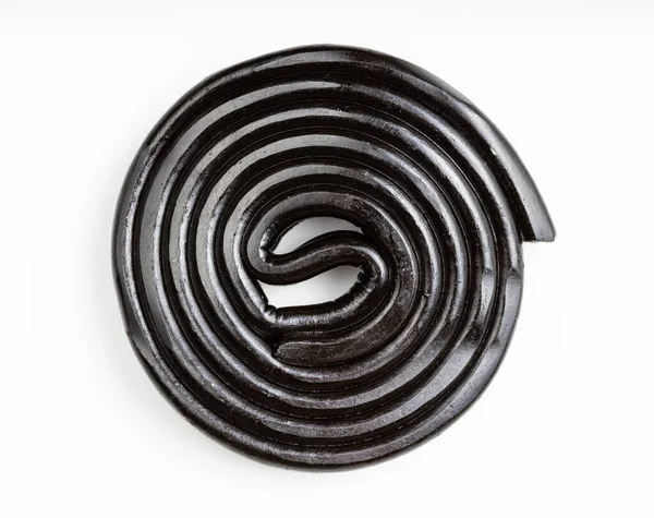 Vista Superior Espiral Caramelo Regaliz Negro Plato Blanco —  Fotos de Stock