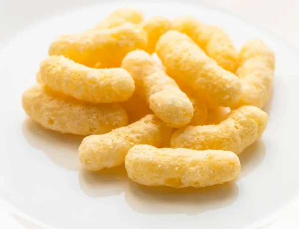 Pile Corn Puffs White Plate Cllose — Stock Photo, Image