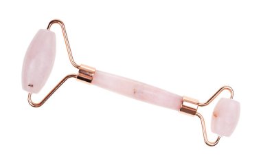 roller massager for traditional chinese face massage gua sha made from natural rose quartz stone isolated on white background