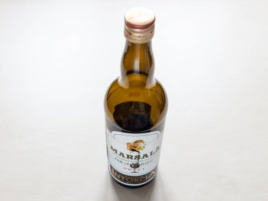 MOSCOW, RUSSIA - JUNE 10, 2021: empty bottle of sweet Marsala from Cantine Intorcia. Marsala is fortified wine, produced in the region surrounding of Marsala city in Sicily, Italy from 1773