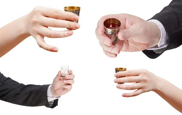 Set of hands with glass of spirits — Stock Photo, Image