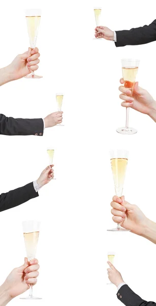 Uppsättning av höjning av champagne glas i handen — Stockfoto