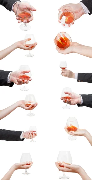 Uppsättning av brandy glasögon i hand isolerade — Stockfoto