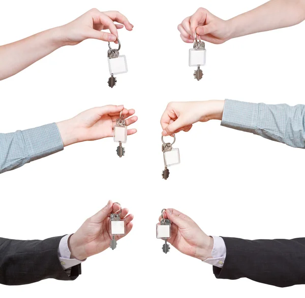 Set of hands with blank door key ring — Stock Photo, Image