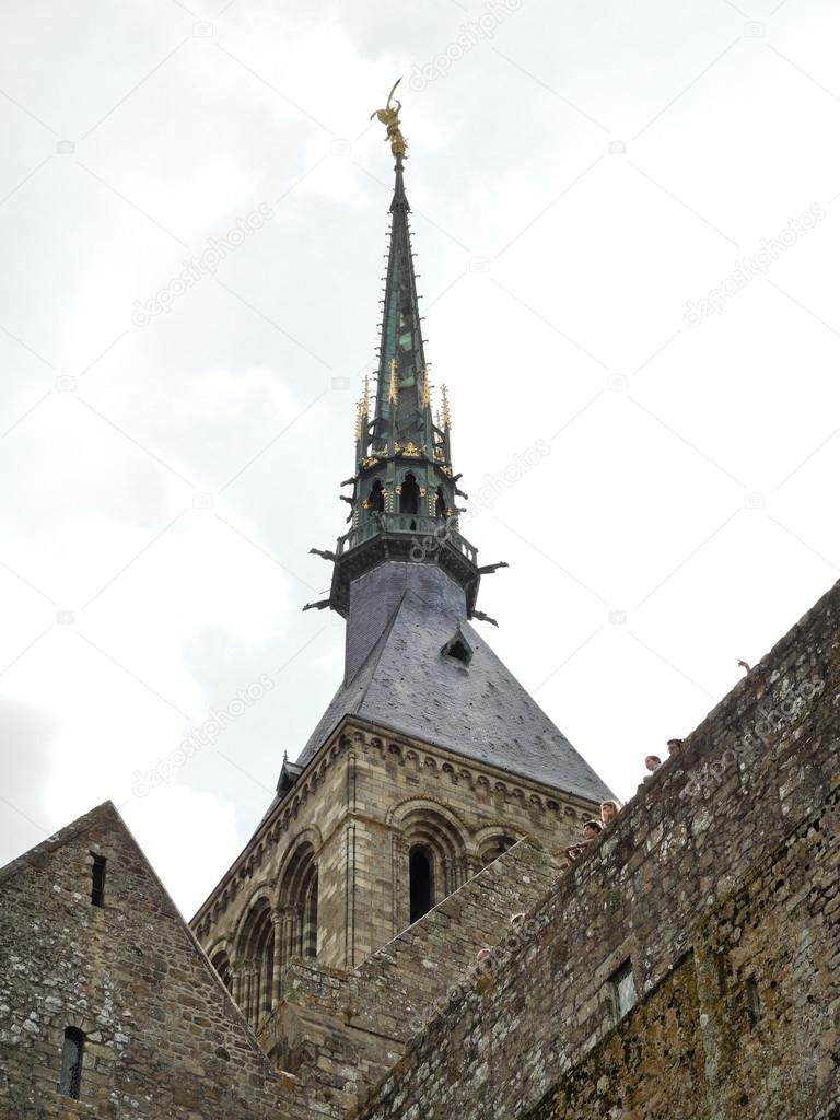 statue on spire of tower abbey mont saint-michel