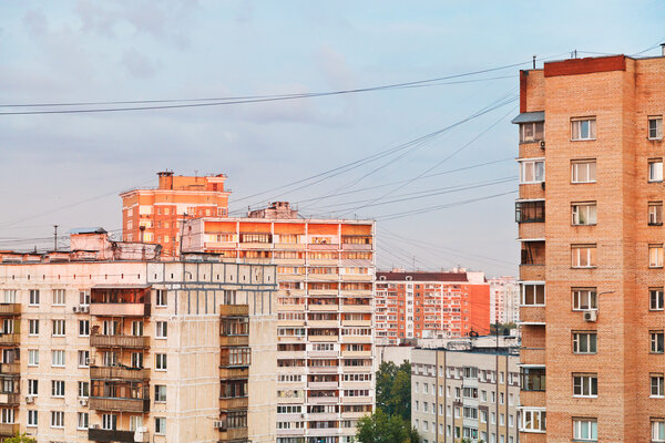 residential buildings in city block at sunset