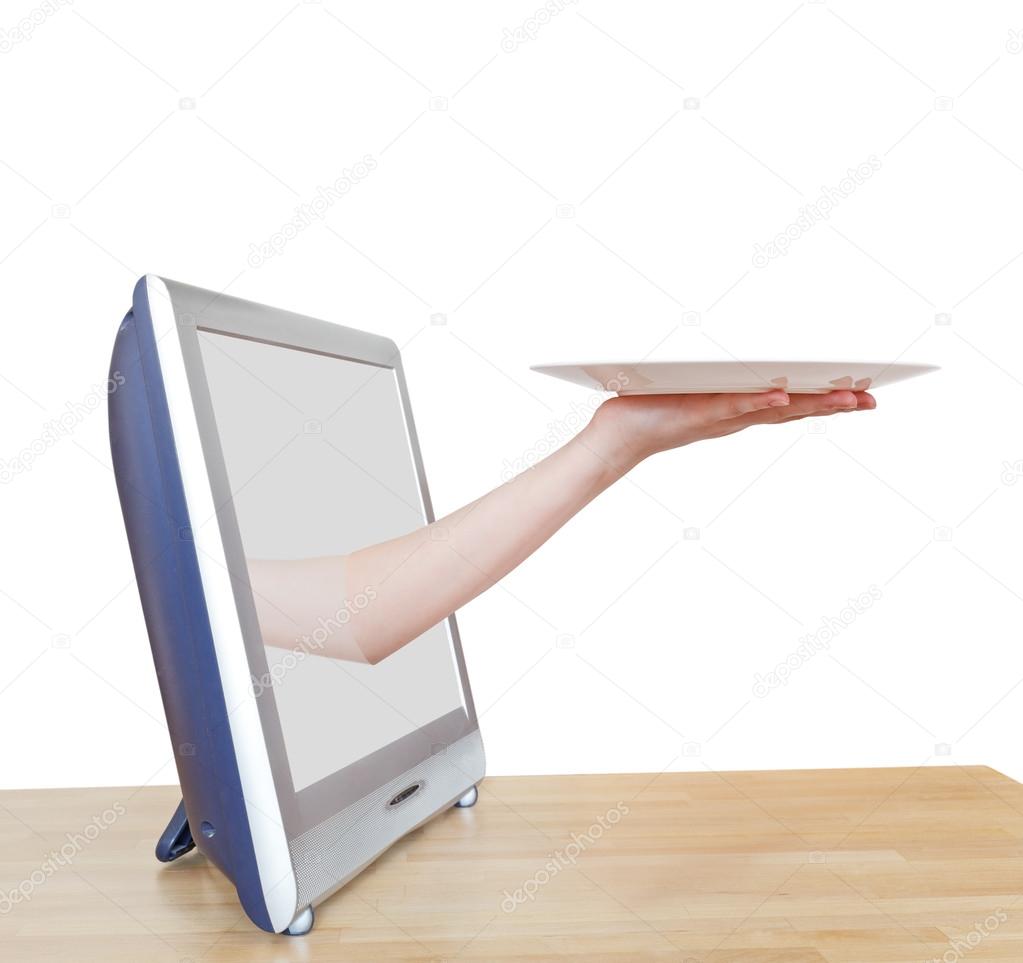 female hand with empty white plate leans out TV