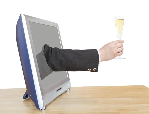 Champagne glas in zakenman hand leunt uit tv — Stockfoto