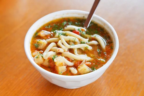 Lagman soup in white bowl — Stock Image Lagman soup in white bowl Royalty Free Stock Photos