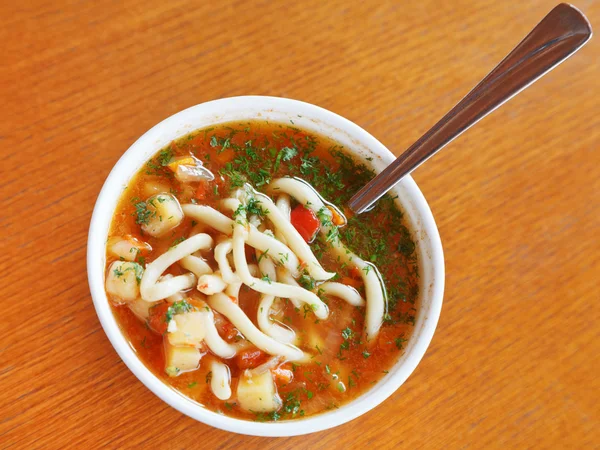 Top view of laghman soup in white bowl — Stock Image Top view of laghman soup in white bowl Royalty Free Stock Images