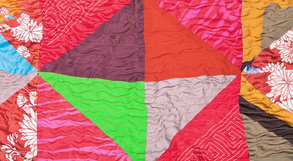 Geometric pattern of silk patchwork quilt — Stock Photo, Image