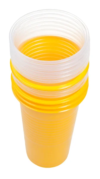 Stack of yellow and transparent plastic glasses — Stock Photo, Image