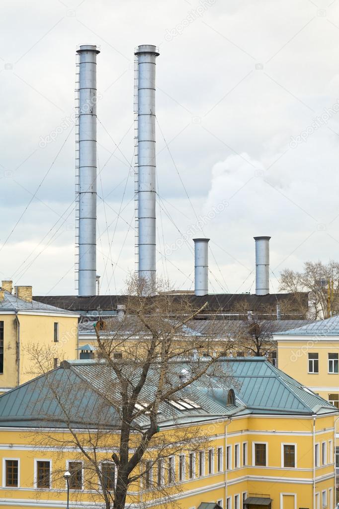 Chimneys of district heating over urban houses