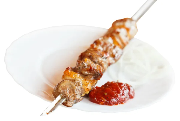 Skewer of lamb shish kebab on white plate isolated — Stock Photo, Image