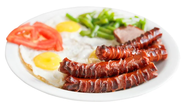 Fried eggs, sausages, tomato on plate isolated — Stock Photo, Image