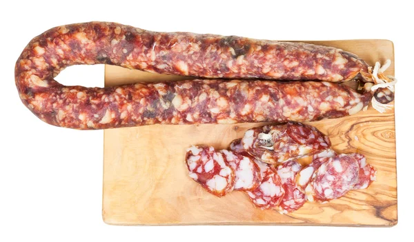 Top view of dried smoked sausage on cutting board — Stock Photo, Image