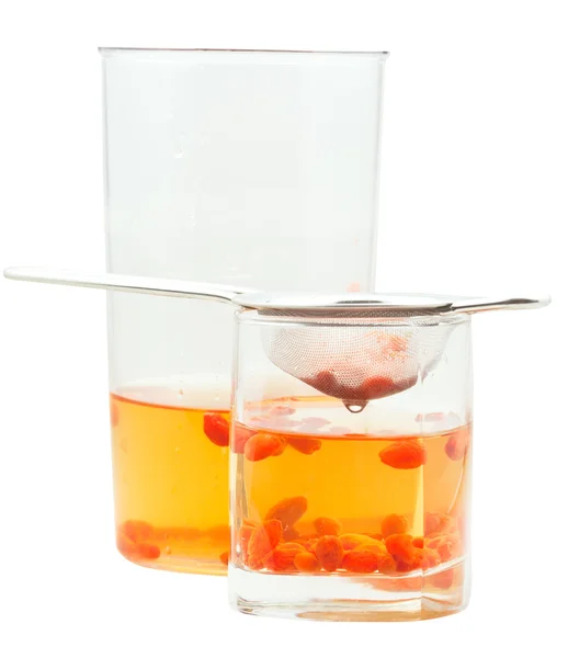 Side view of pot and glass goji berries infusion — Stock Photo, Image