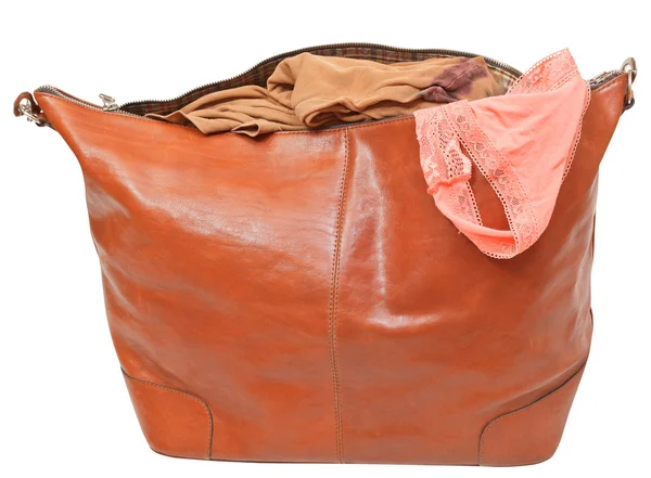 Leather handbag with blouse and pink lace panties — Stock Photo, Image