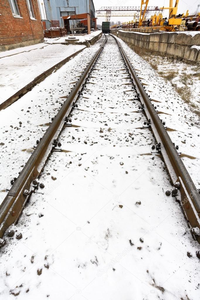railroad in industrial area in winter