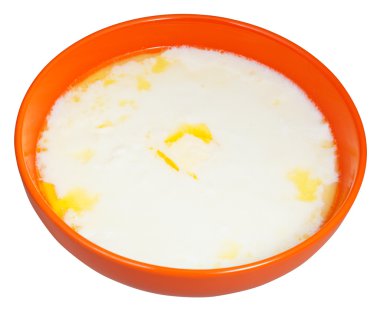 sıcak irmik lapası turuncu kapta tereyağı ile