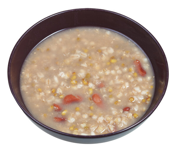rustic bean soup in bowl isolated on white
