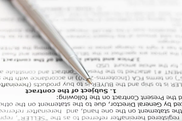 Silver pen on page of sales contract — Stock Photo, Image