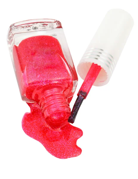 Above view of bottle with spilled pink nail polish — Stock Photo, Image