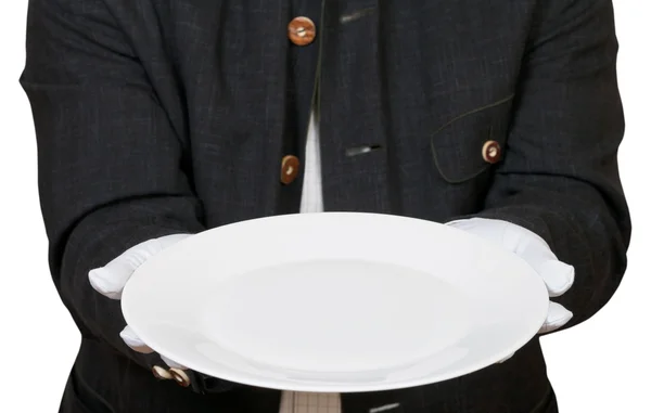Выше вид пустой белой тарелки в руках в перчатках — стоковое фото