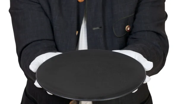 Прямой вид пустой черной тарелки в перчатках — стоковое фото