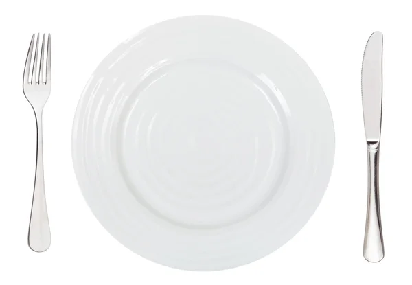 Top view of empty white dinner plate with cutlery — Stock Photo, Image