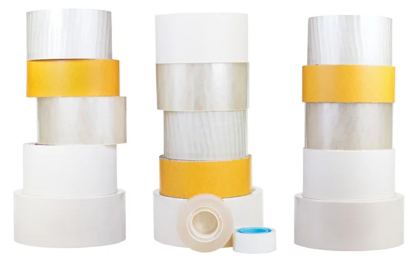 Set of stacks of adhesive tape rolls isolated on white — Stock Photo, Image