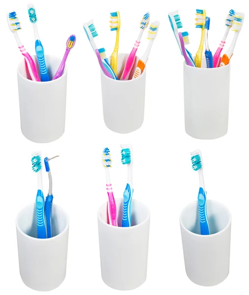 Collection of toothbrushes in ceramic glases — Stock Photo, Image