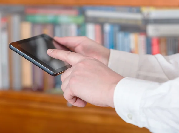 Businessman finger pressing tablet pc screen — Stock Photo, Image